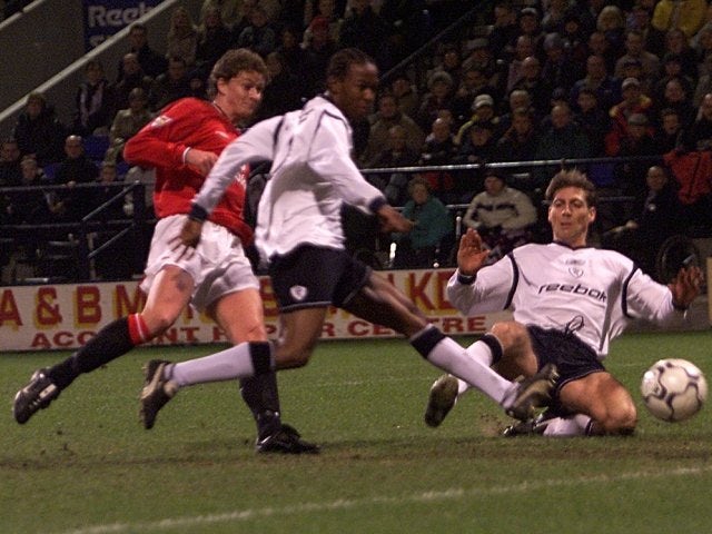 Ole Gunnar Solskjaer scores with a low shot against Bolton Wanderers on January 29, 2002.
