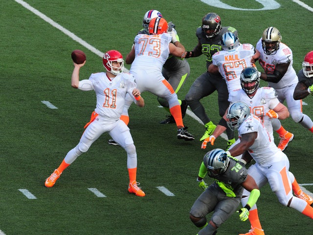 Alex Smith #11 of the Kansas City Chiefs and Team Rice passes against Team Sanders during the 2014 Pro Bowl at Aloha Stadium on January 26, 2014