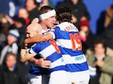 Richard Dunne of Queen Park Rangers celebrates with team mates after scoring during the Sky Bet Championship match between Queens Park Rangers and Burnley at Loftus Road on February 1, 2014