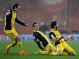 Atletico Madrid's Raul Garcia celebrates with teammates after scoring his team's first goal against Athletic Bilbao during their Copa del Rey match on January 29, 2014