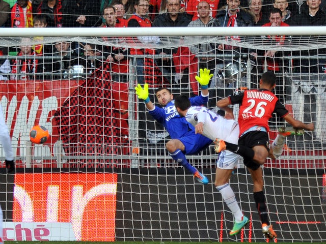 Rennes' French defender Cedric Hountondji scores a header to open the scoring during the French L1 football match Rennes vs Lyon on February 2, 2014
