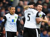 Robert Snodgrass of Norwich City celebrates with Sebastien Bassong after a goal during the Barclays Premier League match against Cardiff City on February 1, 2014