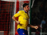 Olivier Giroud of Arsenal celebrates scoring their first goal during the Barclays Premier League match between Southampton and Arsenal at St Mary's Stadium on January 28, 2014