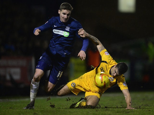 Barry Corr of Southend United battles with Andy Sandell of Newport during the Sky Bet League Two match between Southend United and Newport County at Roots Hall on January 31, 2014