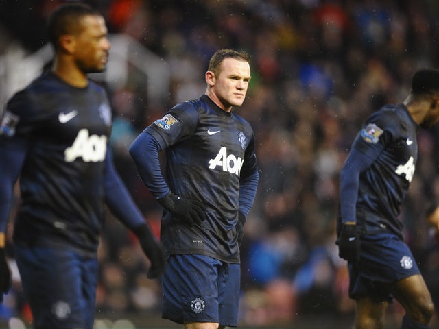 Wayne Rooney of Manchester United looks dejected during the Barclays Premier League match between Stoke City and Manchester United at Britannia Stadium on February 1, 2014