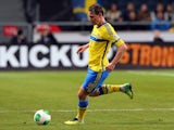 Kim Kallstrom of Sweden runs with the ball during the FIFA 2014 World Cup Qualifier Play-off Second Leg match between Sweden and Portugal at Friends Arena on November 19, 2013