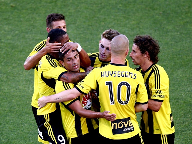 Carlos Hernandex of the Phoenix is surrounded by team mates after scoring his penalty goal during the round 17 A-League match between Wellington Phoenix and Adelaide United at Eden Park on February 1, 2014