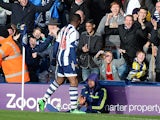 West Bromwich Albion's Nigerian forward Victor Anichebe celebrates after scoring the equalising goal during the English Premier League football match between West Bromwich Albion and Liverpool at The Hawthorns in West Bromwich, central England, on Februar