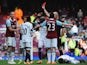 Andy Carroll of West Ham United is sent off by referee Howard Webb after a clash with Chico Flores of Swansea City (R) during the Barclays Premier League match between West Ham United and Swansea City at Boleyn Ground on February 1, 2014