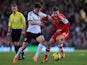 William Kvist (L) of Fulham in action against Adam Lallana of Southampton during the Barclays Premier League on February 1, 2014
