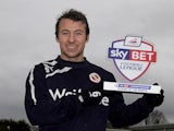 Adam Le Fondre of Reading with his Championship Player of the Month award on February 6, 2014