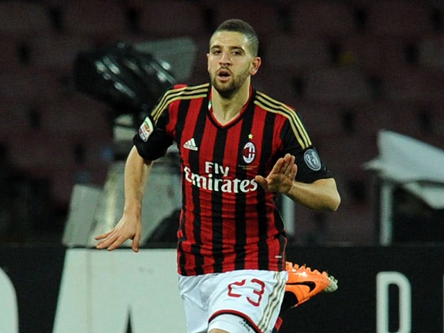 AC Milan's Adel Taarabt celebrates after scoring the opening goal against Napoli during their Serie A match on February 8, 2014