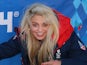 Aimee Fuller of the Great Britain Snowboard Team poses for a photograph in front of a Sochi 2014 sign on February 6, 2014