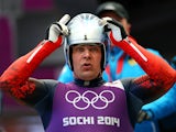 Albert Demchenko of Russia adjusts his helmet during a men's luge training session ahead of the Sochi 2014 Winter Olympics at the Sanki Sliding Center on February 5, 2014