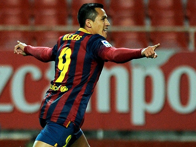 Barcelona's Alexis Sanchez celebrates after scoring his team's first goal against Sevilla on February 9, 2014
