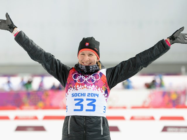 Gold medalist Anastasiya Kuzmina of Slovakia celebrates during the flower ceremony after the Women's 7.5 km Sprint during day two of the Sochi 2014 Winter Olympics at Laura Cross-country Ski & Biathlon Center on February 9, 2014