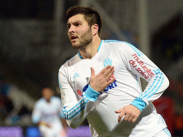 Marseille's Andre-Pierre Gignac after scoring his team's third goal against Bastia during their Ligue 1 match on February 8, 2014