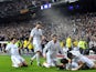 Real Madrid's Argentinian midfielder Angel di Maria (R) is congratuled by his teammates after scoring during the Spanish Copa del Rey (King's Cup) semifinal first-leg football match on February 5, 2014