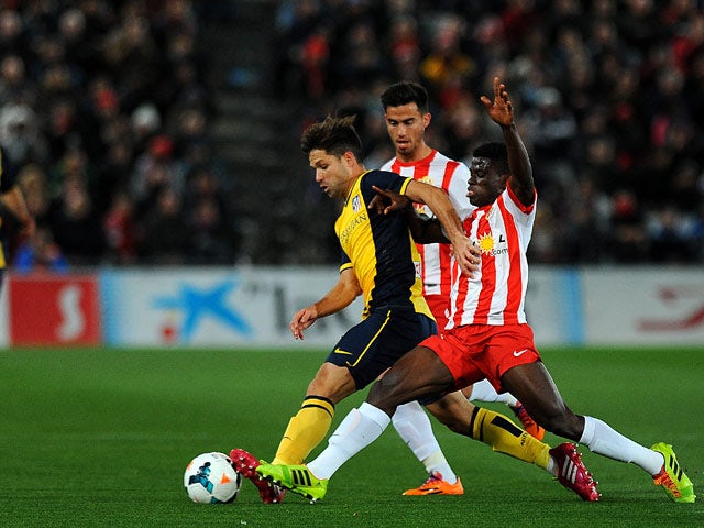 Atletico Madrid's Diego and Almeria's Ramon Azeez in action during their La Liga match on February 8, 2014