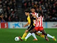 Atletico Madrid's Diego and Almeria's Ramon Azeez in action during their La Liga match on February 8, 2014