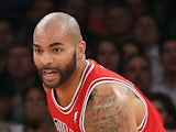 Carlos Boozer of the Chicago Bulls dribbles the ball against the New York Knicks at Madison Square Garden on December 11, 2013