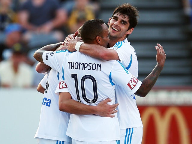 James Troisi of the Victory celebrates with team mates after scoring during the round 18 A-League match between the Central Coast Mariners and the Melbourne Victory at Bluetongue Stadium on February 8, 2014