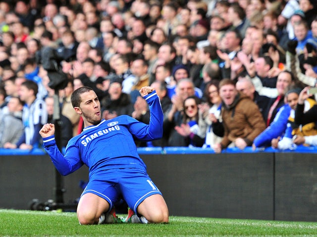 Chelsea's Belgian midfielder Eden Hazard celebrates scoring his second goal during the English Premier League football match between Chelsea and Newcastle United at Stamford Bridge in west London on February 8, 2014