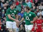 Ireland's Chris Henry celebrates with teammate Devin Toner after scoring the first try against Wales during their Six Nations match on February 8, 2014