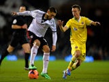Clint Dempsey of Fulham ais marshalled by Stefan Scougall of Sheffield United during the FA Cup Fourth Round Replay match against Sheffield United on February 4, 2014