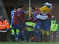 Thomas Ince of Crystal Palace celebrates scoring the first goal with his team-mates and their mascot Pete the Eagle during the Barclays Premier League match between Crystal Palace and West Bromwich Albion at Selhurst Park on February 8, 2014