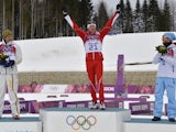 Gold winner Switzerland's Dario Cologna celebrates after the Men's Cross-Country Skiing 15km + 15km Skiathlon at the Laura Cross-Country Ski and Biathlon Center during the Sochi Winter Olympics on February 9, 2014