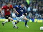 Man United's Darren Fletcher and Everton's Wayne Rooney in action during their Premier League match on February 7, 2004