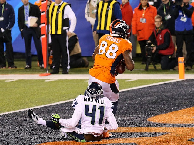 Wide receiver Demaryius Thomas #88 of the Denver Broncos scores on a 14 yard pass during Super Bowl XLVIII against the Seattle Seahawks at MetLife Stadium on February 2, 2014