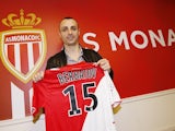 Monaco L1 football club's newly-recruited Bulgarian forward Dimitar Berbatov poses with his new jersey during a press conference on February 4, 2014