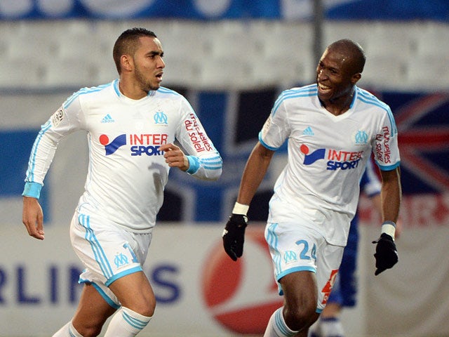 Marseille 's Dimitri Payet celebrates with teammate Rod Fanni after scoring the opening goal against Bastia during their Ligue 1 match on February 8, 2014