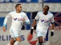 Marseille 's Dimitri Payet celebrates with teammate Rod Fanni after scoring the opening goal against Bastia during their Ligue 1 match on February 8, 2014