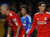 Fernando Torres of Chelsea looks across a Liverpool defenders Martin Skrtel (L), Daniel Agger (2R) and Jamie Carragher )R) during the Barclays Premier League on February 6, 2011
