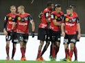 Guingamp's players celebrate after taking the lead against Reims during their Ligue 1 match on February 8, 2014