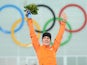 Netherlands' Irene Wust poses on the podium after winning the gold medal in the Women's Speed Skating 3000 m Flower Ceremony at the Adler Arena during the Sochi Winter Olympics on February 9, 2014