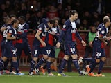 PSG's Javier Pastore is congratulated by teammates after scoring the opening goal against Monaco on February 9, 2014