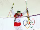 Justine Dufour-Lapointe of Canada celebrates winning gold in the Ladies' Moguls Final 3 on day one of the Sochi 2014 Winter Olympics at Rosa Khutor Extreme Park on February 8, 2014