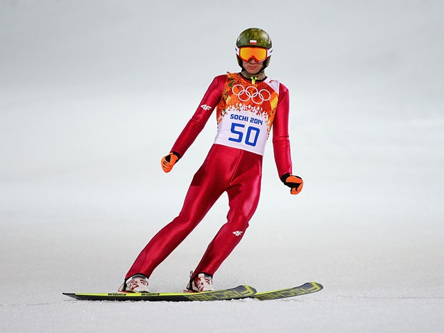 Poland's Kamil Stoch jumps during the Men's Normal Hill Individual first round in the Sochi 2014 Winter Olympics on February 9, 2014