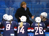 Head coach Katey Stone of the United States talks to her team on the bench during the Women's Ice Hockey Preliminary Round Group A Game against Finland on day 1 of the Sochi 2014 Winter Olympics at Shayba Arena on February 8, 2014