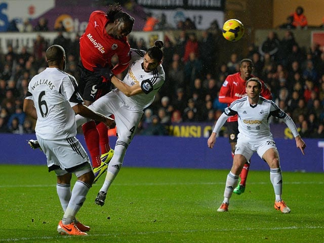 Cardiff's Kenwyne Jones heads wide against Swansea during their Premier League match on February 8, 2014