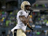 Khiry Robinson #29 of the New Orleans Saints celebrates after scoring on a one-yard touchdown run in the fourth quarter against the Seattle Seahawks on January 11, 2014 
