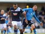 Liam Trotter of Millwall holds off Leeds' Paul Green during the npower Championship match between Millwall and Leeds United at The New Den on November 18, 2012