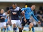Liam Trotter of Millwall holds off Leeds' Paul Green during the npower Championship match between Millwall and Leeds United at The New Den on November 18, 2012