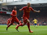 Martin Skrtel of Liverpool celebrates scoring the opening goal during the Barclays Premier League match between Liverpool and Arsenal at Anfield on February 8, 2014