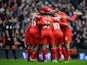 Daniel Sturridge of Liverpool celebrates with his team-mates after scoring the fourth goal during the Barclays Premier League match between Liverpool and Arsenal at Anfield on February 8, 2014