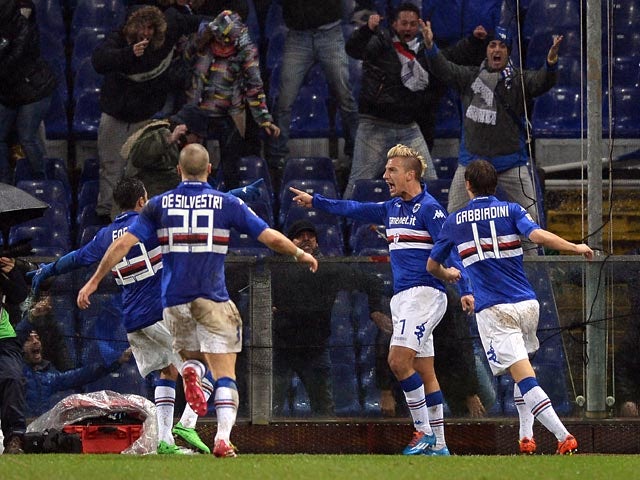 Sampdoria's Maxi Lopez celebrates with teammates after scoring the opening goal against Genoa during their Serie A match on February 3, 2014